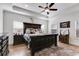 Bedroom featuring tray ceilings, hardwood floors, decorative elements, and plenty of natural light at 1721 Mcgarity Rd, Temple, GA 30179