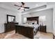 Bedroom featuring tray ceilings, hardwood floors, decorative elements, and plenty of natural light at 1721 Mcgarity Rd, Temple, GA 30179