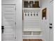 Mudroom with built-in shelving, coat hooks, and bench, perfect for organization at 1721 Mcgarity Rd, Temple, GA 30179