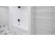 Bathroom featuring a tub and shower combo with wire shelves at 180 Oliver Dr, Locust Grove, GA 30248