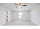 Bright bedroom featuring a ceiling fan, carpet, and neutral walls at 180 Oliver Dr, Locust Grove, GA 30248