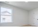 Bright bedroom with neutral carpet and white walls at 180 Oliver Dr, Locust Grove, GA 30248