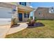 Charming two-story home featuring a two-car garage, brick accents, and a well-manicured lawn at 180 Oliver Dr, Locust Grove, GA 30248
