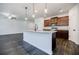 Modern kitchen with granite countertops, stainless steel appliances, and dark wood cabinetry at 180 Oliver Dr, Locust Grove, GA 30248