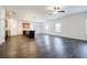Open-concept living area featuring modern flooring, kitchen island, and stainless appliances at 180 Oliver Dr, Locust Grove, GA 30248