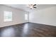 Bright living room featuring wood floors, neutral walls, and a ceiling fan at 180 Oliver Dr, Locust Grove, GA 30248