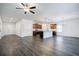 Open-concept living area featuring modern flooring, kitchen island, and stainless appliances at 180 Oliver Dr, Locust Grove, GA 30248