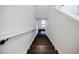 View of the staircase with wooden steps and white railings at 180 Oliver Dr, Locust Grove, GA 30248