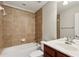This full bathroom features a tub, a sink and a mirror, all complemented by decorative tile at 2149 Shoop Se Ct # 3, Smyrna, GA 30080