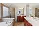 Ensuite bathroom featuring dual vanities, a separate tub, and a glass-enclosed shower at 2149 Shoop Se Ct # 3, Smyrna, GA 30080