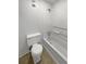 Bright bathroom featuring a shower-tub combo, and a toilet at 607 Park Ridge Cir, Marietta, GA 30068