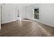 Bright bedroom with wood-look floors, a neutral color scheme, and ample natural light at 607 Park Ridge Cir, Marietta, GA 30068