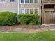Exterior view showing manicured landscaping, hedges, and neutral color siding at 607 Park Ridge Cir, Marietta, GA 30068