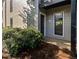 Image of front entrance with apartment number, well maintained shrubbery, and modern siding at 607 Park Ridge Cir, Marietta, GA 30068