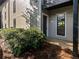 Condo exterior with neutral siding and well-manicured landscaping providing a welcoming entrance at 607 Park Ridge Cir, Marietta, GA 30068