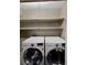 Laundry room with updated machines and shelving unit at 607 Park Ridge Cir, Marietta, GA 30068