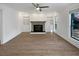 Bright living room featuring a fireplace, built-in shelving, and ample natural light at 607 Park Ridge Cir, Marietta, GA 30068