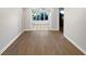 Spacious living room with wood laminate flooring and view to sunroom at 607 Park Ridge Cir, Marietta, GA 30068