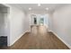 Bright living room featuring recessed lighting and newly installed light wood floors throughout at 607 Park Ridge Cir, Marietta, GA 30068