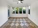 A sunroom with tiled floors and updated windows at 607 Park Ridge Cir, Marietta, GA 30068