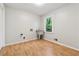 Utility room featuring wood-look flooring, paint walls and a utility sink at 745 Greenvine Pl, Roswell, GA 30076