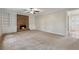 Large living room with fireplace, built-in shelves, and plush carpet at 745 Greenvine Pl, Roswell, GA 30076