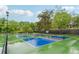 Community pickleball courts featuring shaded benches and professional surfaces at 745 Greenvine Pl, Roswell, GA 30076