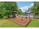 Community playground featuring slides, swings, and a safety mulch surface at 745 Greenvine Pl, Roswell, GA 30076