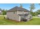 This home features a beautiful backyard patio area with seating, perfect for outdoor relaxation and entertaining at 130 W Pier Way, Fayetteville, GA 30214