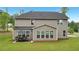 This home features a beautiful backyard patio area with seating, perfect for outdoor relaxation and entertaining at 130 W Pier Way, Fayetteville, GA 30214