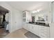 A bright bathroom with a spacious vanity and an adjacent walk-in closet at 130 W Pier Way, Fayetteville, GA 30214