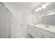 Bright bathroom with double vanity, white cabinets and a large mirror, offering ample space at 130 W Pier Way, Fayetteville, GA 30214