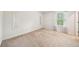 Well lit bedroom with carpeting, a window with blinds, and a full length mirror at 130 W Pier Way, Fayetteville, GA 30214