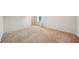 Neutral bedroom featuring plush carpeting and an entry doorway near a window at 130 W Pier Way, Fayetteville, GA 30214