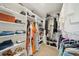 Spacious walk-in closet with shelving, providing storage and organization at 130 W Pier Way, Fayetteville, GA 30214