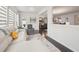 Cozy living room with a white sofa and lots of natural light from the large window at 130 W Pier Way, Fayetteville, GA 30214