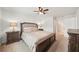 Comfortable main bedroom featuring a king-sized bed, two nightstands, and neutral décor at 130 W Pier Way, Fayetteville, GA 30214