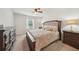 Cozy main bedroom with a king-sized bed, dresser, bedside tables and natural light at 130 W Pier Way, Fayetteville, GA 30214