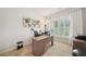 Well-lit home office with a large window, neutral carpet, and a spacious desk at 130 W Pier Way, Fayetteville, GA 30214