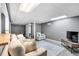 Cozy finished basement with plush seating and a neutral color palette creates a comfortable and inviting space at 305 Devilla Trce, Fayetteville, GA 30214