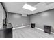 Finished basement featuring wood-look floors, ample space, and modern furnishings at 305 Devilla Trce, Fayetteville, GA 30214