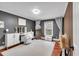 Bright bedroom featuring stylish decor, including a vanity table, full-length mirror, and soft rug at 305 Devilla Trce, Fayetteville, GA 30214