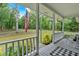 Inviting front porch with a view of the large front yard, perfect for relaxing and enjoying the outdoors at 305 Devilla Trce, Fayetteville, GA 30214