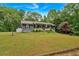 Lovely one-story home with a spacious front yard, perfect for outdoor activities and curb appeal at 305 Devilla Trce, Fayetteville, GA 30214
