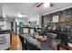 Well-equipped kitchen with stainless steel appliances, breakfast bar, and open dining area at 305 Devilla Trce, Fayetteville, GA 30214