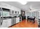 Bright kitchen featuring stainless appliances, granite countertops, and a cozy dining area at 305 Devilla Trce, Fayetteville, GA 30214