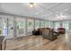 Bright living room with large windows, ample seating, and stylish decor, perfect for entertaining at 305 Devilla Trce, Fayetteville, GA 30214