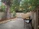 Serene backyard patio with bistro seating, string lights, and a decorative lattice fence at 3119 Colonial Way # H, Atlanta, GA 30341