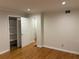 This bedroom features hardwood floors and a closet, with a view to another room through a doorway at 3119 Colonial Way # H, Atlanta, GA 30341