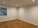 The bedroom features hardwood floors, neutral walls, and natural light from the window at 3119 Colonial Way # H, Atlanta, GA 30341